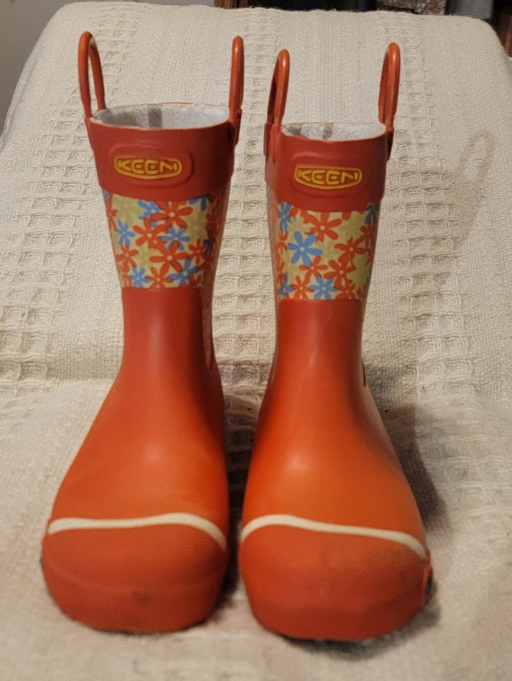 Keen orange and floral-patterned Coronado kids' waterproof rain boots